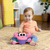 BRIGHT STARTS Jucărie muzicală și multisenzorială Rockin' Crawling Crab™ - Roz, 6m+