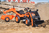 Falk Trettraktor 2065N Kubota Bagger mit Frontlader und Anhänger mit Drehbagger
