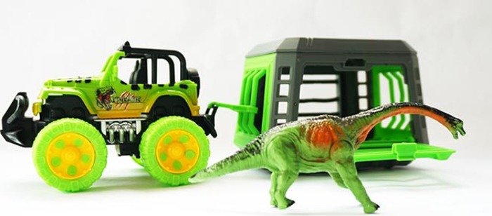 Jeep s přívěsem a dinosaurem