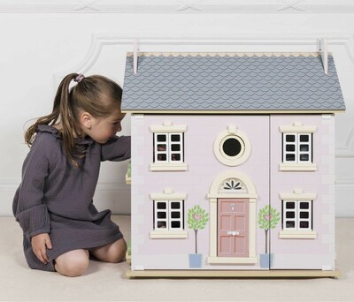 H107-girl-playing-through-window-of-thebay-tree-dolls-house.jpg