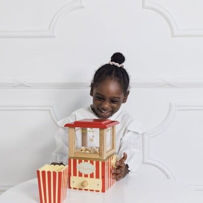 TV318-girl-laughing-at-popping-popcorn-machine.jpg