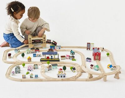 TV701-london-train-set-boy-girl-moving-locomotive-through-bridge.jpg