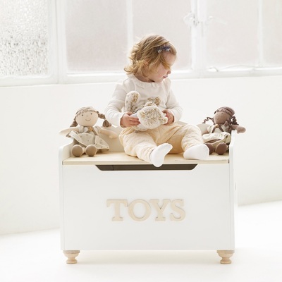 TV606-toy-chest-girl-sitting-with-plush-doll-friends.jpg