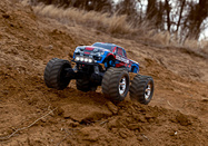 67054-61-Stampede-4x4-ACTION-3QtrFront-Red-RGB-091A6802-Web.jpg