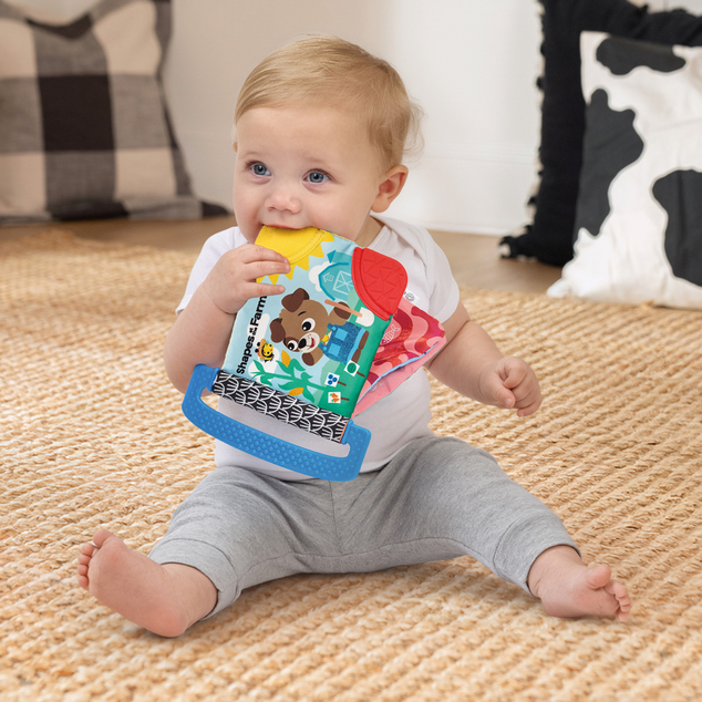 BABY EINSTEIN Puha könyv rágókákkal és textúrákkal Shapes at the Farm™, 0m+