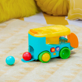BRIGHT STARTS Autíčko vkladacie s loptičkami Pop &amp; Roll Safari Bus™